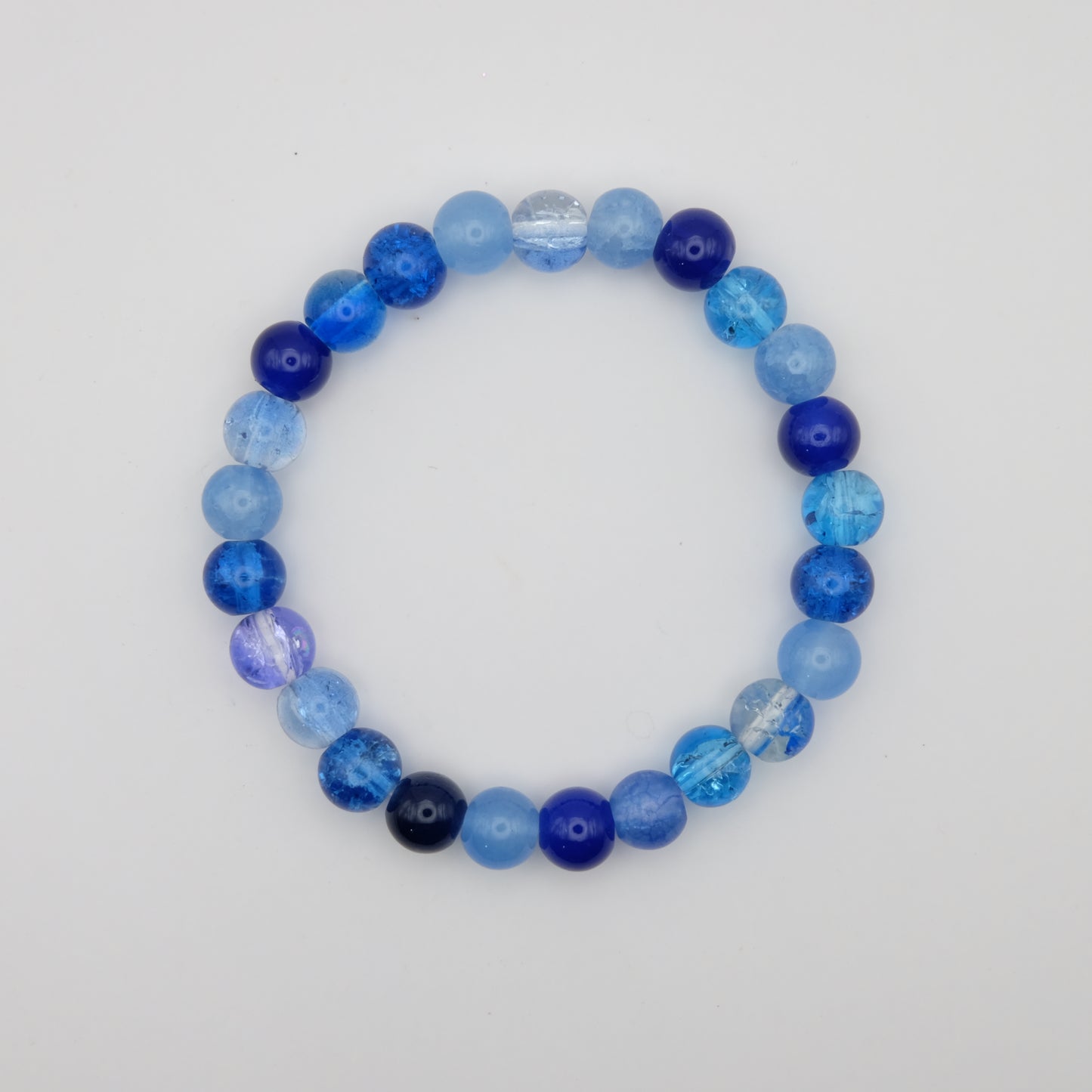 Blue beaded bracelet on a white background