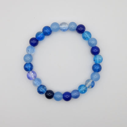 Blue beaded bracelet on a white background