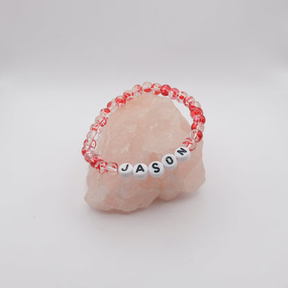 Bracelet with 'JASON' beads on a pink stone