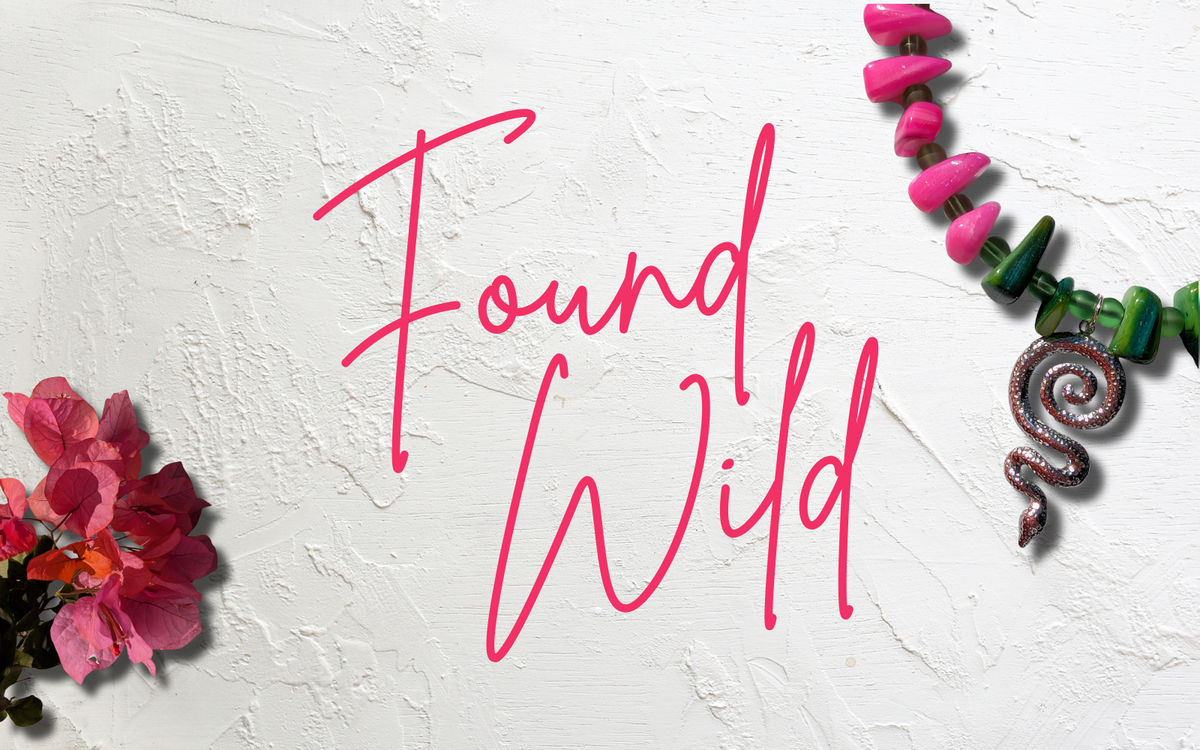 Found Wild collection banner with bright pink and green beaded snake necklace, pink bougainvillea and handwritten pink Found Wild text.