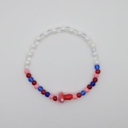 Beaded necklace with red, blue, and pink beads on a light gray background