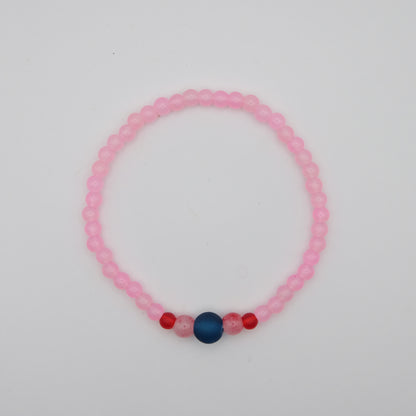 Pink beaded bracelet with blue and red beads on a white background