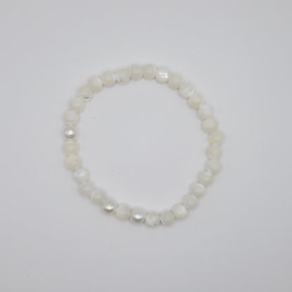 Pearl bracelet on a light gray background