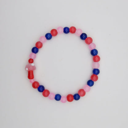 Beaded bracelet with red, blue, and pink beads on a white background
