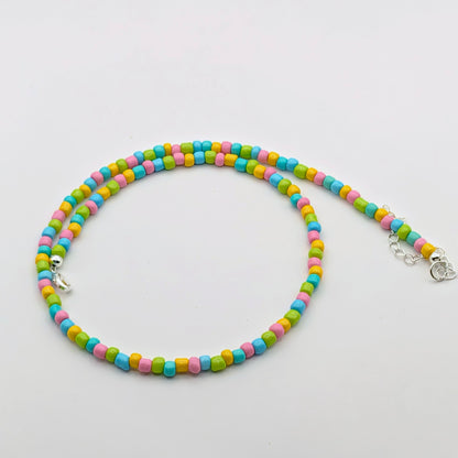 Fran handmade colourful necklace featuring aqua, pink, green and yellow glass beads with silver hardware and adjustable chain.