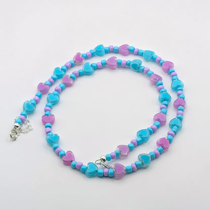 Wendy colourful beaded necklace with aqua blue and lilac glass beads, translucent blue and purple heart beads and silver adjustable hardware.