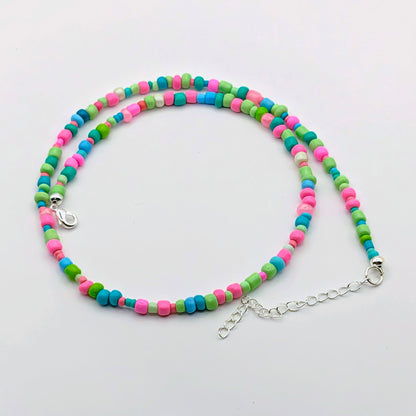 Janice colourful handmade beaded necklace with bright pink, green and blue glass beads and silver adjustable clasp by Velveteen Sunshine.