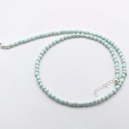 Bianca handmade beaded necklace with mint green glass beads, pale pink accent beads and silver adjustable clasp, handmade by Velveteen Sunshine.