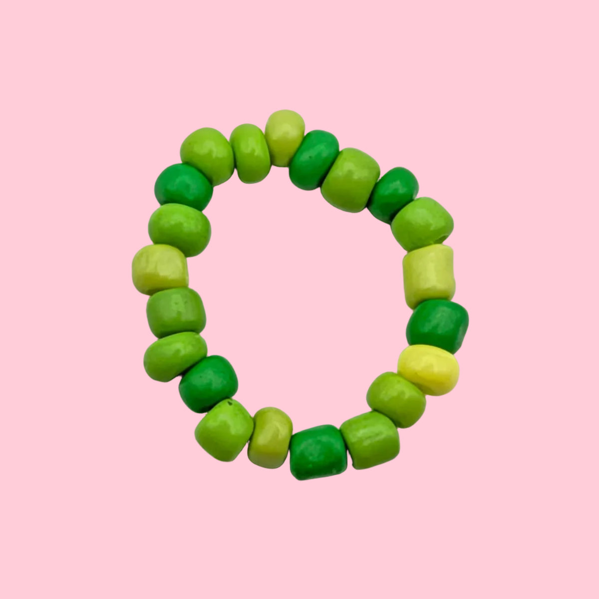 A beaded stretch ring made of glossy, rounded beads in various shades of green and lime green, arranged in a circle on a plain white background.