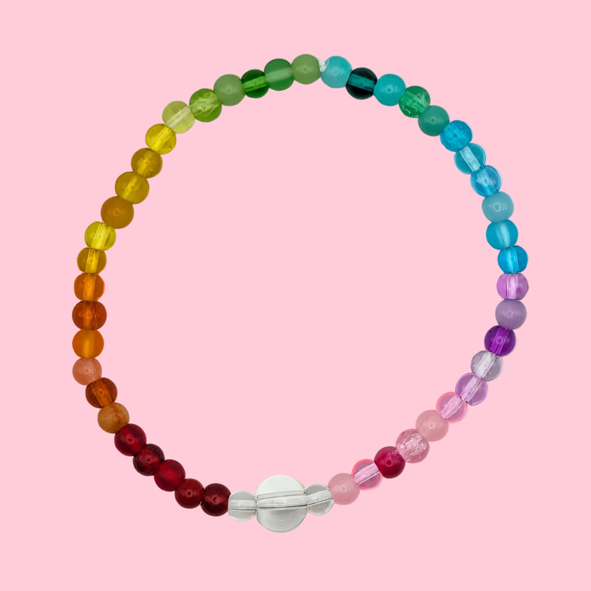 A beaded bracelet arranged in a circle, featuring translucent faceted beads in rainbow colors from yellow and orange to green, blue, purple, and pink, with a clear central bead and silver clasp, on a plain white background.