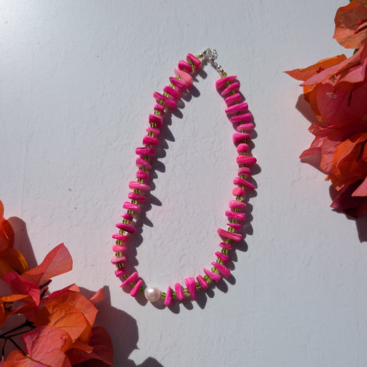 Handmade pink and green beaded necklace with pink shell chip beads, green glass beads and a single freshwater pearl.