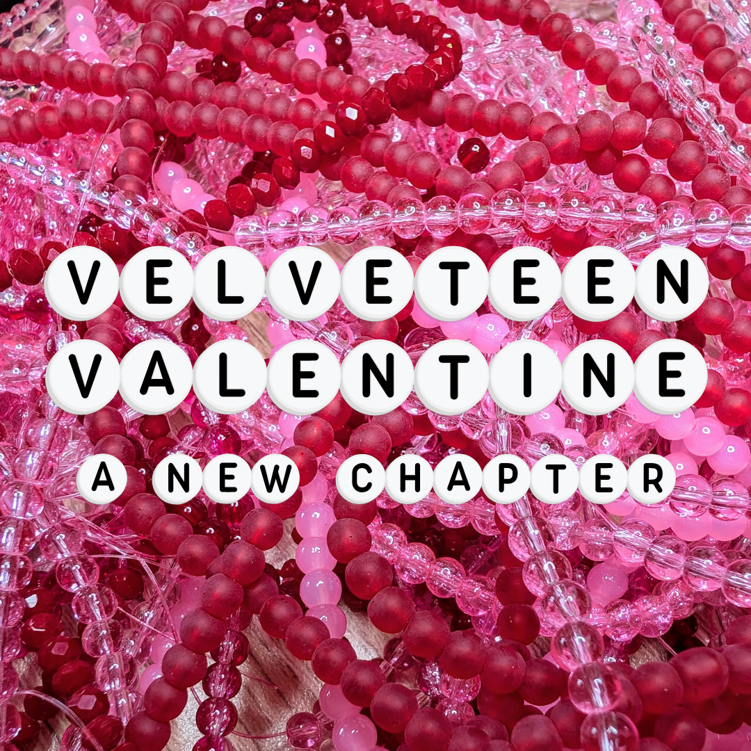 A bold mix of red and pink elastic beaded bracelets made from glossy and frosted glass beads, with letter beads spelling “Velveteen Valentine – A New Chapter.” A whimsical and romantic handmade jewellery collection full of dopamine jewellery and colourful accessories, crafted for quirky jewellery lovers.