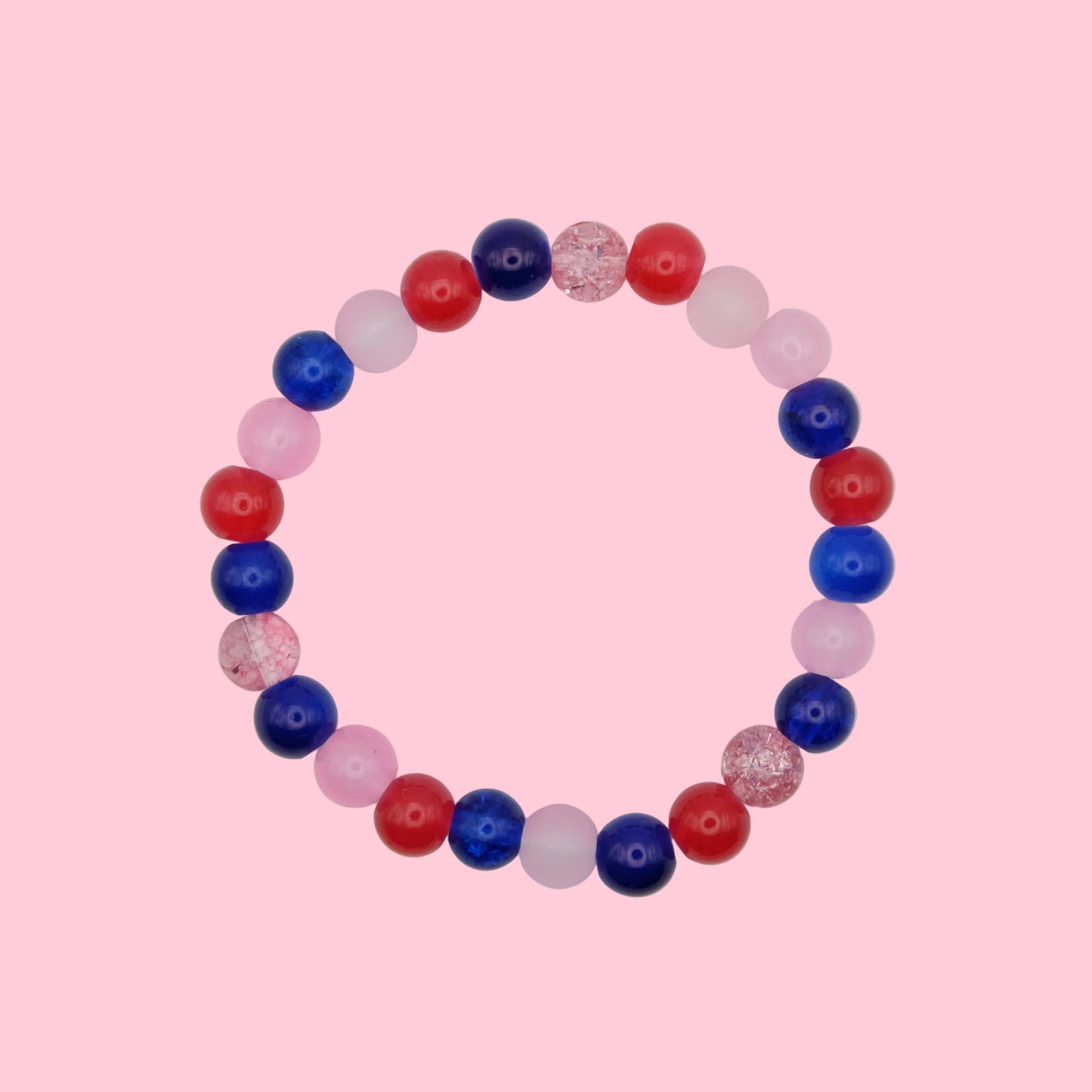 An elastic beaded bracelet composed of 6mm glass beads in red, blue and pink tones - featuring mixed finishes for texture, shown on a white background.