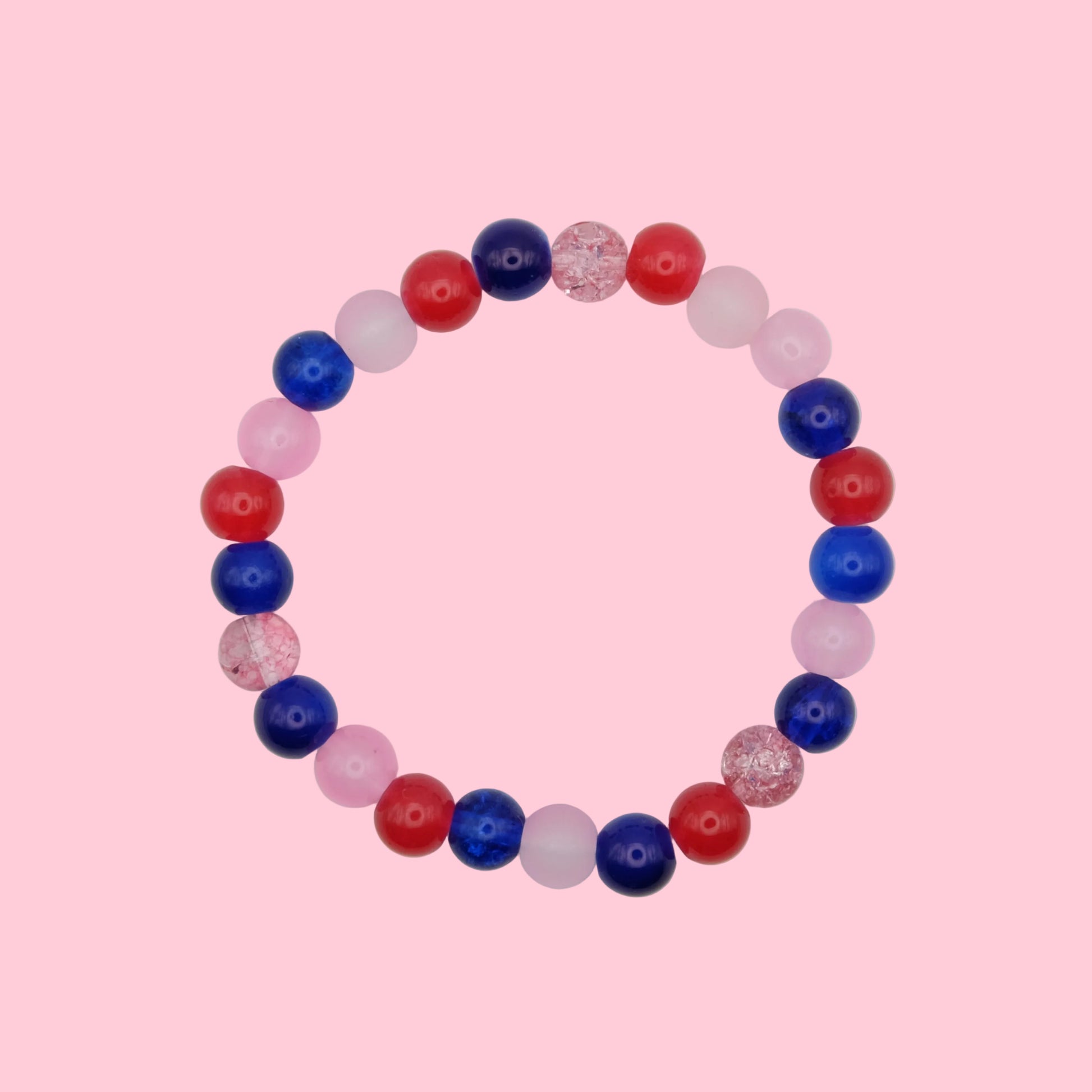 An elastic beaded bracelet composed of 6mm glass beads in red, blue and pink tones - featuring mixed finishes for texture, shown on a white background.